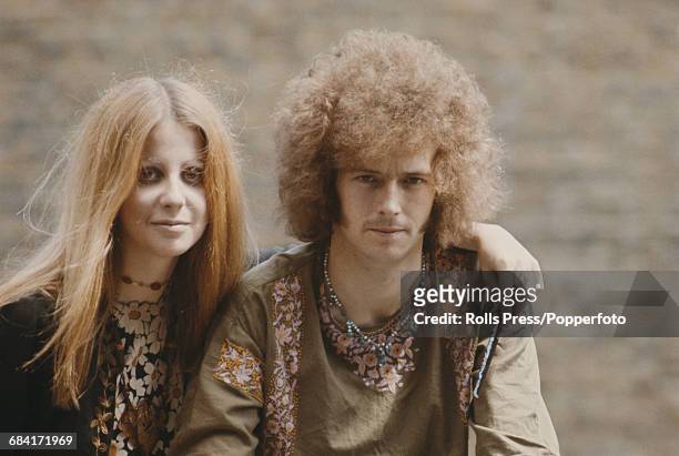 English musician and guitarist with the blues rock group Cream, Eric Clapton posed with his girlfriend Charlotte Martin in London in summer 1967.