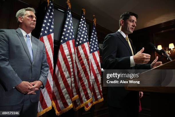 Speaker of the House Rep. Paul Ryan speaks as House Majority Leader Rep. Kevin McCarthy looks on during a news briefing at the headquarters of...