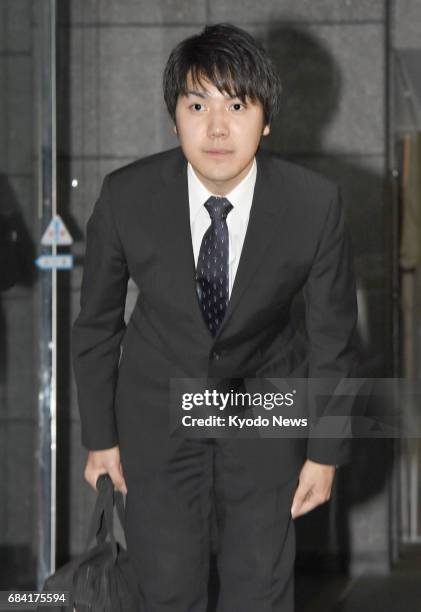 Kei Komuro, who will soon become engaged to Princess Mako, a granddaughter of Emperor Akihito, bows to reporters who gathered to meet him outside the...