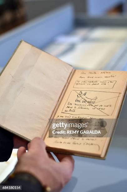 Note book belonging to artist Antoine de Saint-Exupéry is shown at the Museum of Old Toulouse on May 17 prior to the set of 12 drawings and 7 letters...