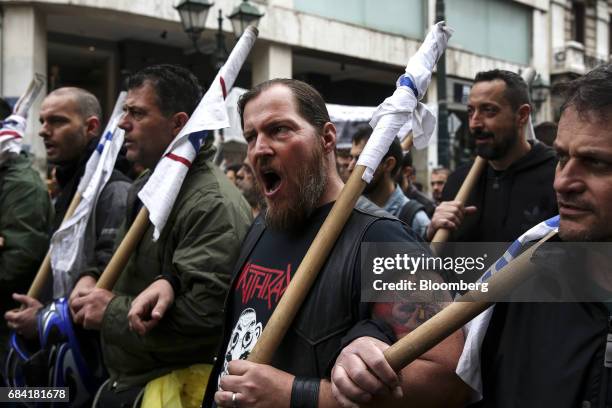 Protesters chant slogans as they take part in an anti-government rally during a 24-hour labour strike in Athens, Greece, on Wednesday, May 17, 2017....