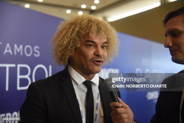 Former footballer Carlos Valderrama speaks upon arrival at the Conmebol headquarters in Luque, Paraguay, on May 17, 2017 to participate in a meeting...