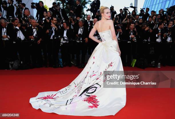 Elle Fanning attends the "Ismael's Ghosts " screening and Opening Gala during the 70th annual Cannes Film Festival at Palais des Festivals on May 17,...