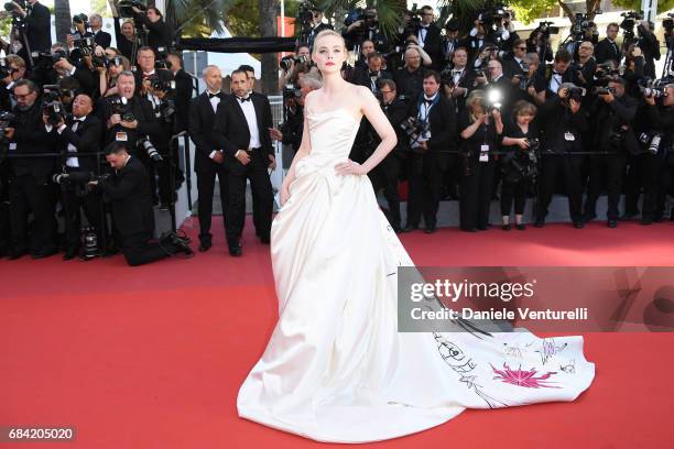 Elle Fanning attends the "Ismael's Ghosts " screening and Opening Gala during the 70th annual Cannes Film Festival at Palais des Festivals on May 17,...