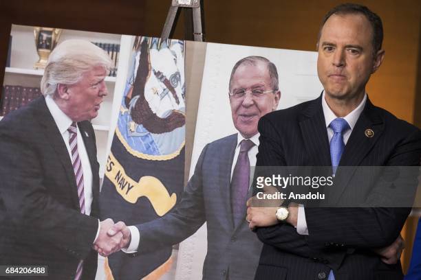 Congressman Adam Schiff, Ranking Member of the House Permanent Select Committee on Intelligence, stands next to a photo released by the Russian State...