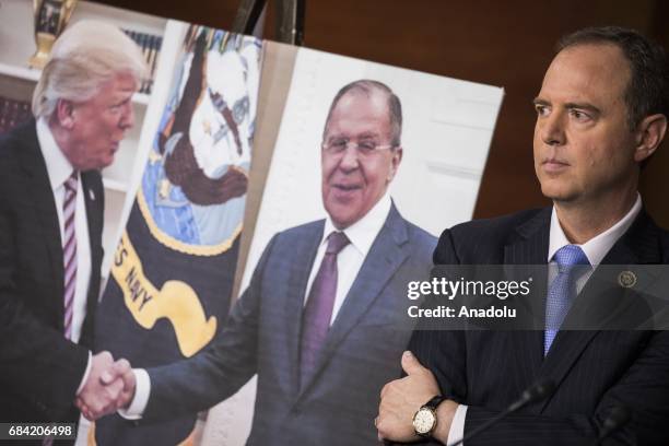 Congressman Adam Schiff, Ranking Member of the House Permanent Select Committee on Intelligence, stands next to a photo released by the Russian State...
