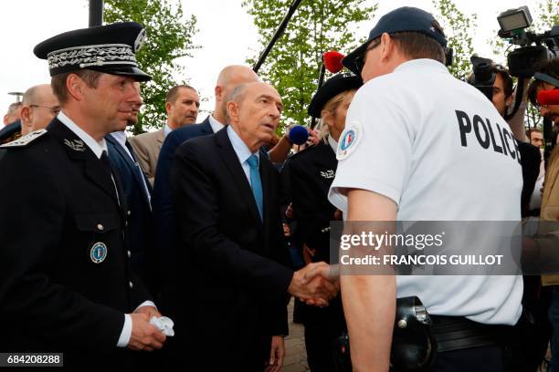 Newly appointed French Interior Minister Gerard Collomb visits the police headquarters in Trappes, near Paris, on May 17 as part of his first...