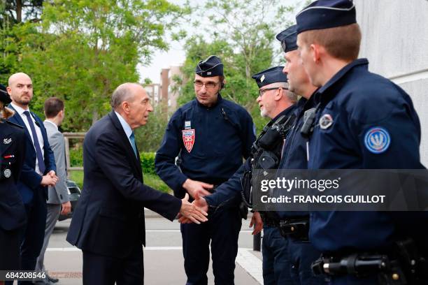 Newly appointed French Interior Minister Gerard Collomb visits the police headquarters in Trappes, near Paris, on May 17 as part of his first...