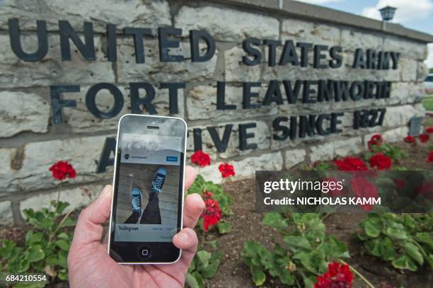 This photo illustration shows Chelsea Manning's first Instagram post in front of US Army facility Fort Leavenworth in Leavenworth, Kansas, on May 17,...