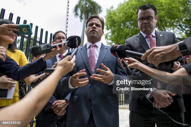 Elias Sanchez, Governor Ricardo Rossello's representative on the federal board, speaks to members of the media outside the Federal Courthouse in San...