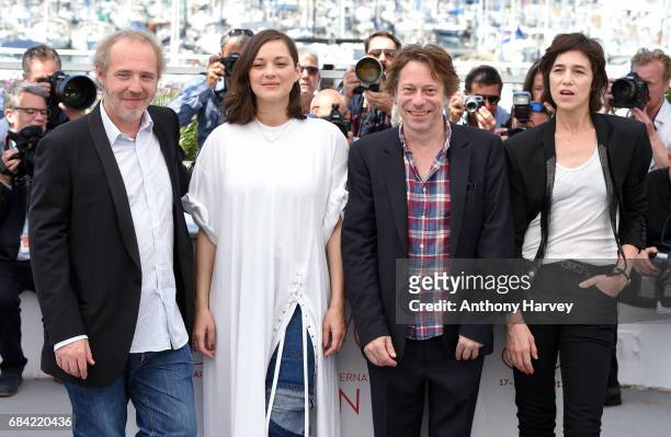 Director Arnaud Desplechin, actors Marion Cotillard, Mathieu Amalric and Charlotte Gainsbourg attend the "Ismael's Ghosts " photocall during the 70th...