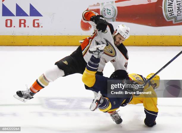 Jared Boll of the Anaheim Ducks hits Harry Zolnierczyk of the Nashville Predators in Game Three of the Western Conference Final during the 2017 NHL...