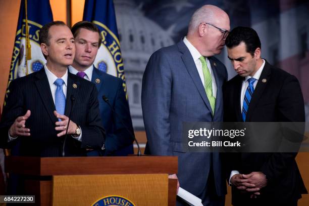 Chairman of the Democratic Caucus Rep. Joseph Crowley, D-N.Y., whispers to Rep. Ruben Kihuen, D-Nev., at right as House Intelligence ranking member...