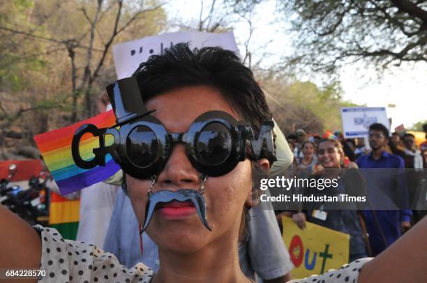 Community member along with supporters taking part in central India`s first gay pride parade taken out to mark the International Day against...