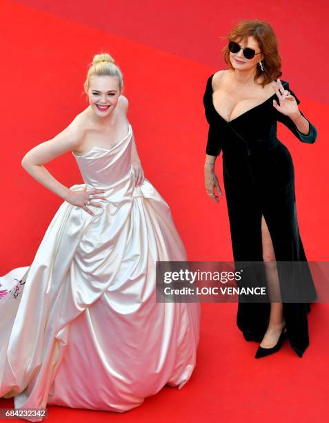 Actresses Elle Fanning and Susan Sarandon pose as they arrive on May 17, 2017 for the screening of the film 'Ismael's Ghosts' during the opening...