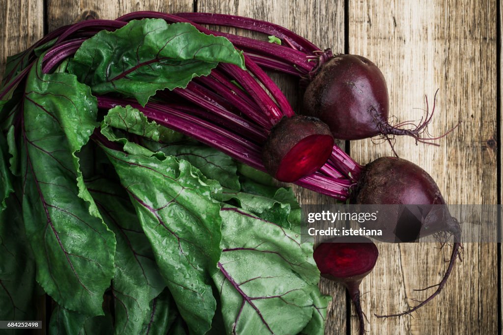 Fresh organic beetroot over wooden background