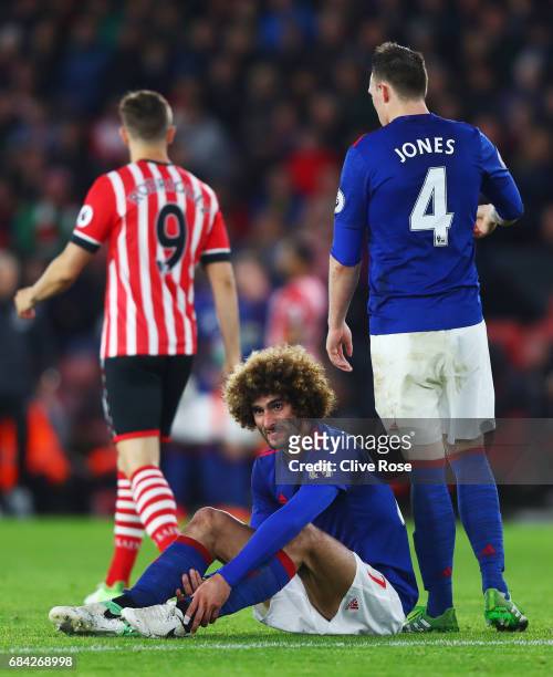 Marouane Fellaini of Manchester United goes down injured during the Premier League match between Southampton and Manchester United at St Mary's...