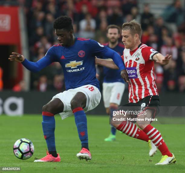 Axel Tuanzebe of Manchester United in action with Steven Davis of Southampton during the Premier League match between Southampton and Manchester...