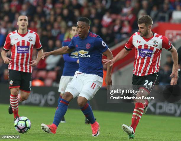 Anthony Martial of Manchester United in action with Jack Stephens of Southampton during the Premier League match between Southampton and Manchester...