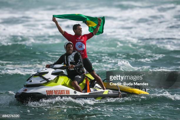 Adriano de Souza of Brazil celebrates his title of the Oi Rio Pro 2017 at Itauna Beach on May 17, 2017 in Saquarema, Brazil.
