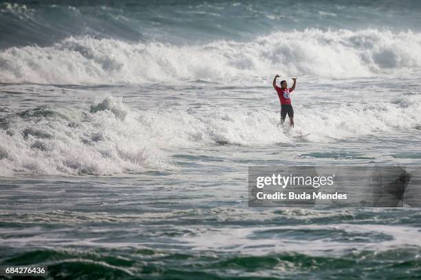 Adriano de Souza of Brazil celebrates his title of the Oi Rio Pro 2017 at Itauna Beach on May 17, 2017 in Saquarema, Brazil.