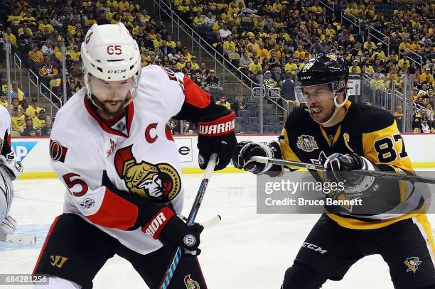 Sidney Crosby of the Pittsburgh Penguins checks Erik Karlsson of the Ottawa Senators in Game Two of the Eastern Conference Final during the 2017 NHL...