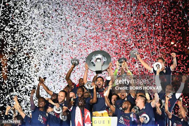 Monaco players celebrate at the end of their last French L1 football match Monaco vs St Etienne on May 17, 2017 at the "Louis II Stadium" in Monaco....