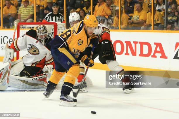 Anaheim Ducks goalie John Gibson protects the post as Anaheim Ducks defenseman Hampus Lindholm defends against Nashville Predators right wing Viktor...