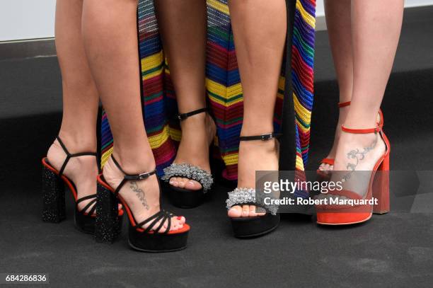 Antonella Roccuzzo, Daniella Semaan and Sofia Balbi, Sarkany shoe detail, attend a photocall for the new Sarkany Boutique opening on May 17, 2017 in...