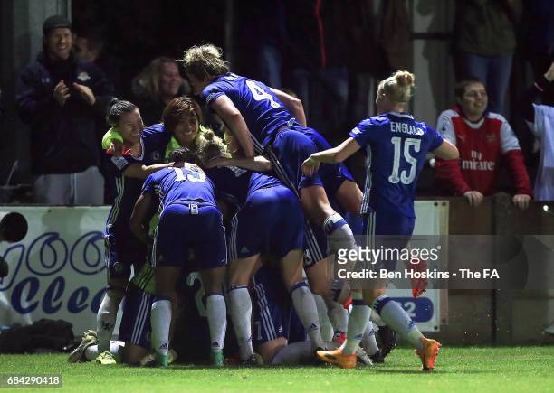 Drew Spence of Chelsea is mobbed by team mates after scoring her team's second goal of the game during the WSL 1 match between Chelsea Ladies and...