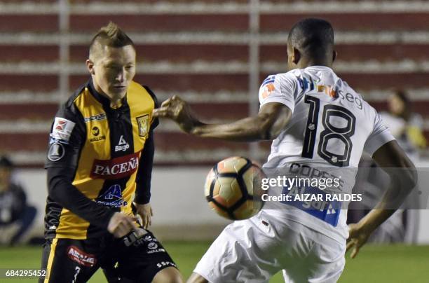 Alejandro Chumacero of Bolivia's The Strongest vies for the ball with Jonathan Copete of Brazilian Santos during a Copa Libertadores football match...