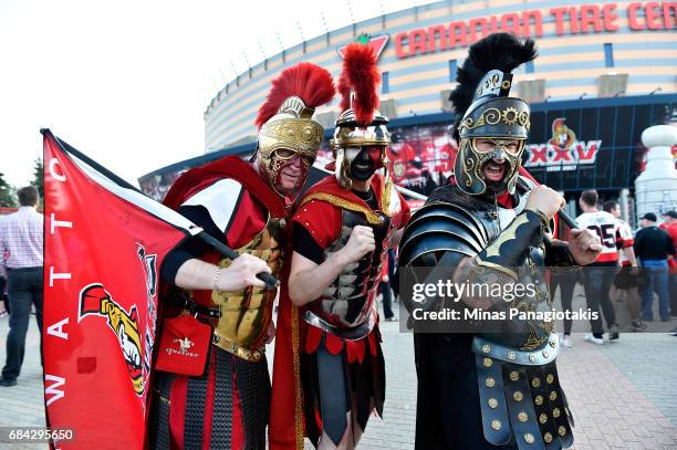 Fans dressed up as gladiators pose outside the arena prior Game Three of the Eastern Conference Final between the Pittsburgh Penguins and the Ottawa...