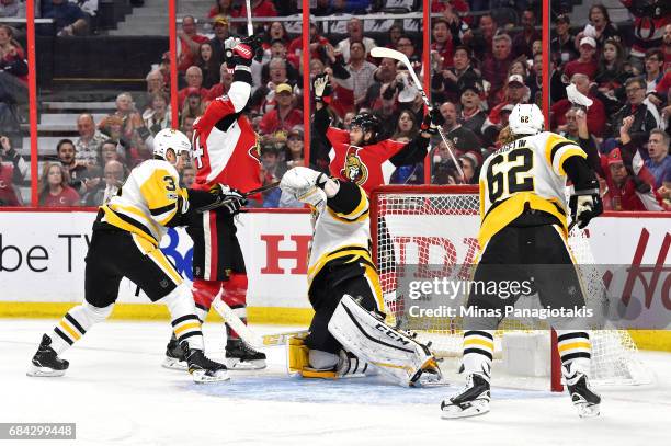 Mike Hoffman of the Ottawa Senators celebrates with Alex Burrows after scoring a goal against Marc-Andre Fleury of the Pittsburgh Penguins during the...