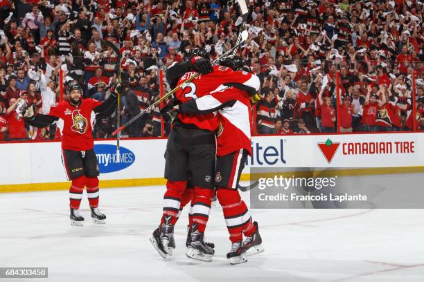 Clarke MacArthur and Marc Methot of the Ottawa Senators celebrates a first period goal against the Pittsburgh Penguins in Game Three of the Eastern...