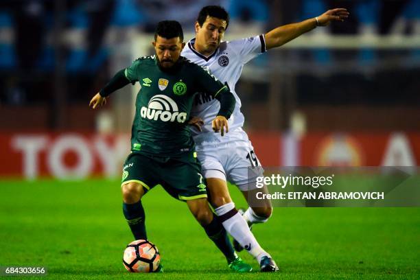 Argentina's Lanus midfielder Nicolas Aguirre vies for the ball with Brazil's Chapecoense forward Rossi during the Copa Libertadores 2017 group first...