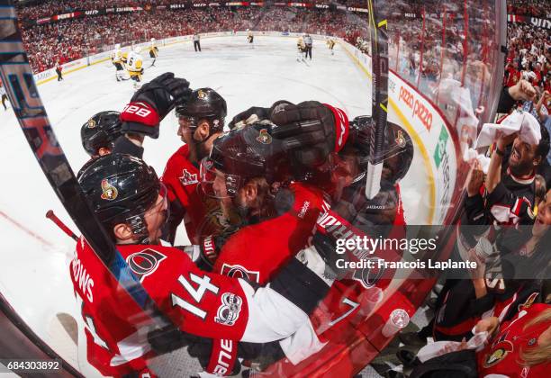 Mike Hoffman of the Ottawa Senators celebrates his fist period goal with teammates Alex Burrows, Viktor Stalberg and Kyle Turris in Game Three of the...