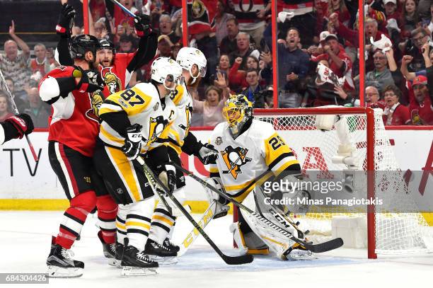 Marc Methot of the Ottawa Senators scores a goal against Marc-Andre Fleury of the Pittsburgh Penguins during the first period in Game Three of the...