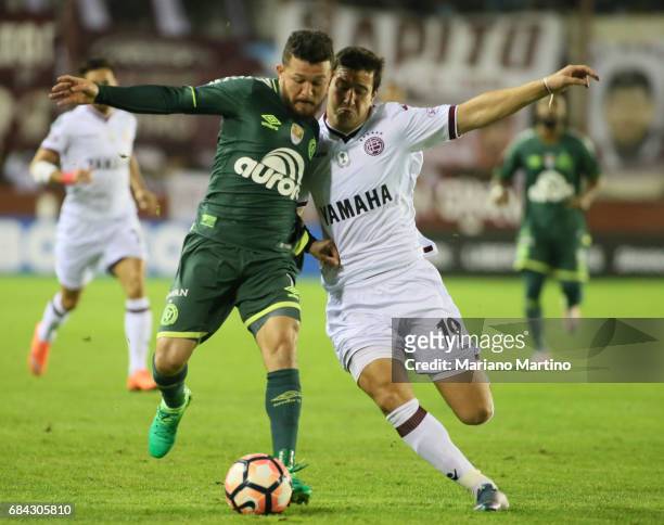Rosicley Pereira of Chapecoense and Nicolas Aguirre of Lanus fight for the ball during a group stage match between Lanus and Chapecoense as part of...