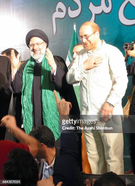 Iranian presidential candidate Ebrahim Raisi and former presidential candidate and mayor of Tehran, Mohammad Bagher Ghalibaf , greet supporters...