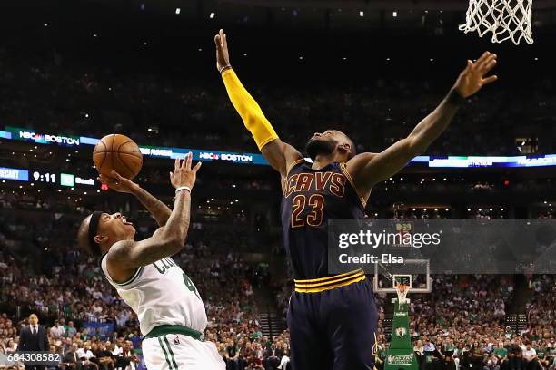 LeBron James of the Cleveland Cavaliers attempts to block a shot by Isaiah Thomas of the Boston Celtics in the first half during Game One of the 2017...