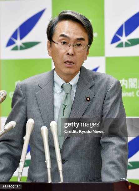 Nobuteru Ishihara, Japan's minister in charge of revitalizing the economy, speaks at a press conference in Tokyo on May 18 about gross domestic...