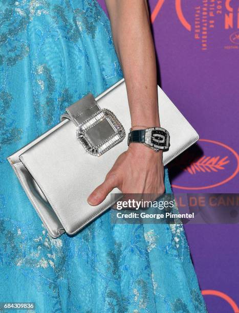 Detail of Michelle Yeoh purse and watch at the Opening Gala dinner during the 70th annual Cannes Film Festival at Palais des Festivals on May 17,...