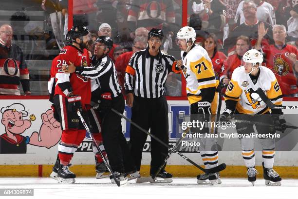 Viktor Stalberg of the Ottawa Senators argues with Evgeni Malkin of the Pittsburgh Penguins during the second period in Game Three of the Eastern...