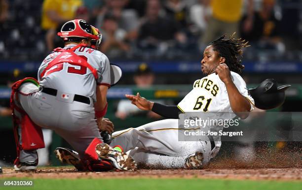 Gift Ngoepe of the Pittsburgh Pirates is tagged out by Jose Lobaton of the Washington Nationals during the eighth inning at PNC Park on May 17, 2017...