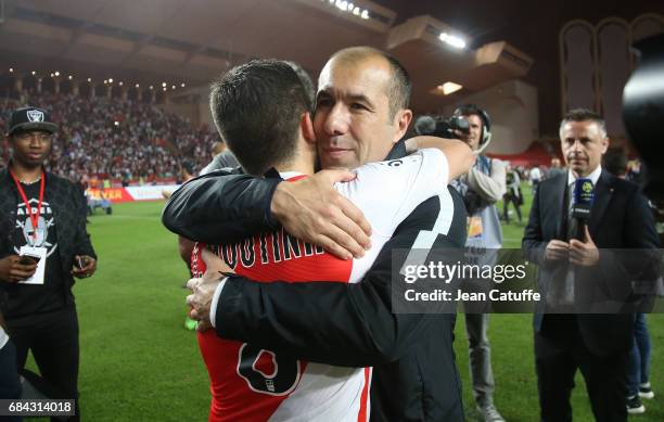 Coach of Monaco Leonardo Jardim hugs countryman Joao Moutinho during the French League 1 Championship title celebration following the French Ligue 1...