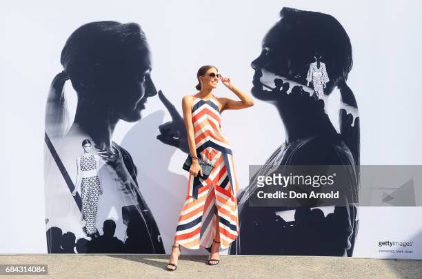 Erin Holland wears Sass and Bide outfit, Prada sunglasses, Siren shoes and Mimco clutch during Mercedes-Benz Fashion Week Resort 18 Collections at...