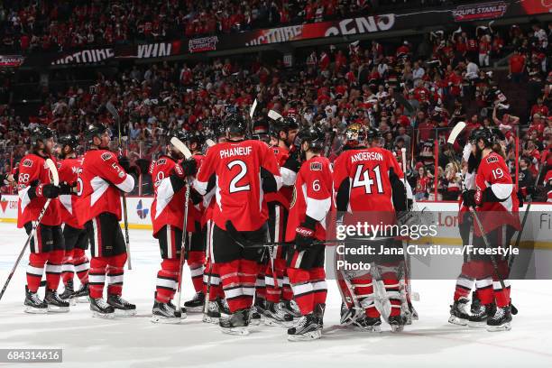 Craig Anderson of the Ottawa Senators celebrates with his teammates after defeating the Pittsburgh Penguins with a score of 5 to 1 in Game Three of...