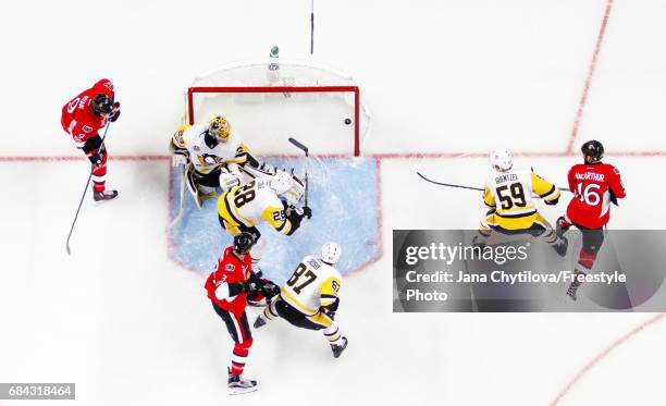 Marc Methot of the Ottawa Senators celebrates his first period goal with teammates Bobby Ryan and Clarke MacArthur as Marc-Andre Fleury, Sidney...