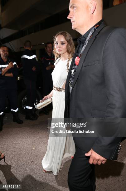 Lily-Rose Depp, daughter of Johnny Depp, leaves the "Ismael's Ghosts " screening and Opening Gala during the 70th annual Cannes Film Festival at...