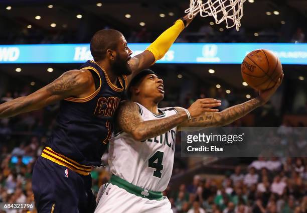 Isaiah Thomas of the Boston Celtics drives to the basket against Kyrie Irving of the Cleveland Cavaliers in the second half during Game One of the...